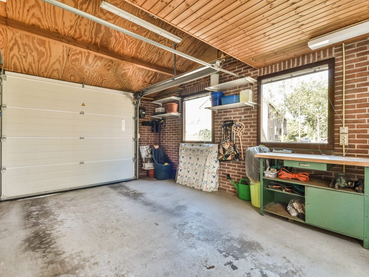 Storage room with pipes and metering devices. A long room with engineering communications in the modern apartment